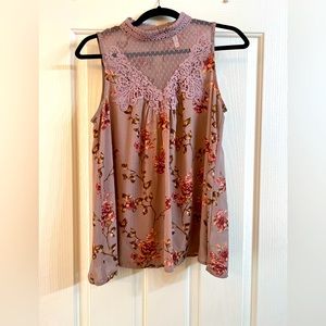 Xhilaration Woman’s Mock Neck Floral Top with Lace design in front.